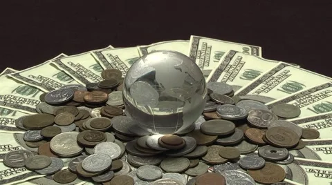 Globe rotates over money Stock Footage 43011076