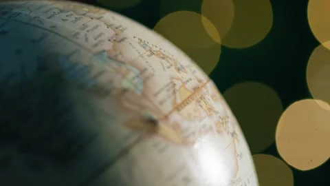 Globe Rotating Slowly with Bokeh Lights in the Dark Background Vídeos de archivo 331106787