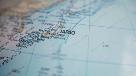 A globe spinning and stopping on Japan with a shallow depth of field Stock Footage