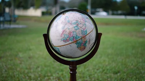 Globe Spinning Outside in a Park Stock Footage 76273519