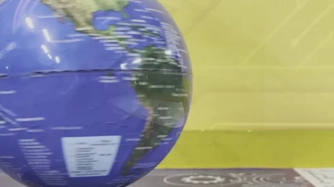 A globe is spinning on a table Stock-Footage 283484648