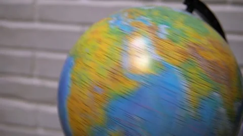 Globe spinning on white background. Learning about the globe Stockbeeldmateriaal 120305498