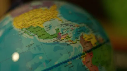 Globe spins gently over colorful continents Stock Footage 342354204