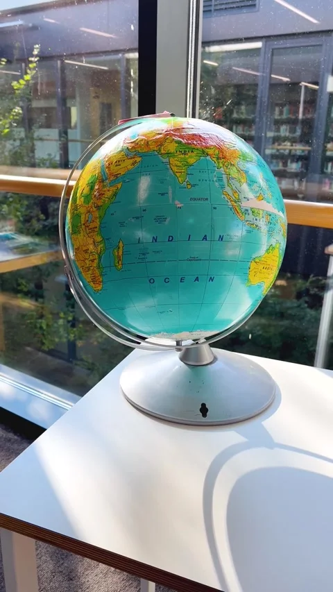 Globe on a table near a window in an educational institution. Stock Footage 288176756