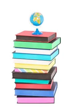 A globe on top of stack of colorful books Stock Photos