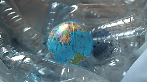 Globe under plastic bottles. No plastic concept. Eco-friendly environment. Stock Footage 129325177