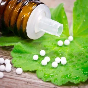 Globuli on leaf Stock Photos