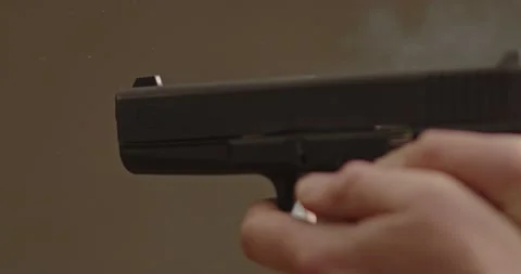 A Glock 17 handgun being fired with low recoil Stock Footage 229754893