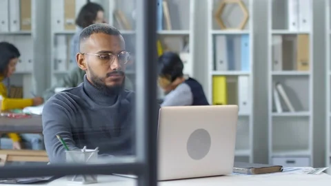 Gloomy Black Web Developer Working on Laptop Stock Footage 111056642