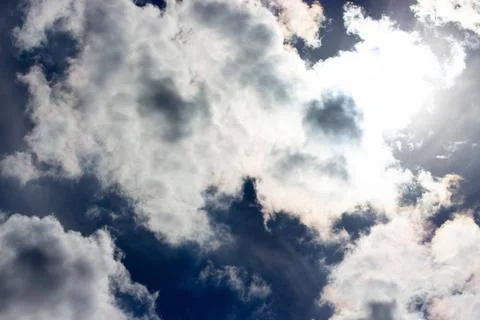 Gloomy dark dramatic sky white heaped clouds. Blue cloudscape backdrop, be... 写真素材