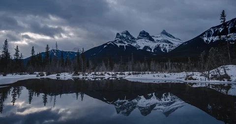 Gloomy day cloudscape time lapse of the Three Sisters Reflecting on the Water Stock Footage 93865987