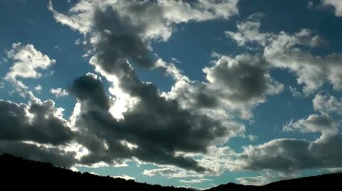Gloomy gray clouds closing the sun move over a dark. Time lapse 動画素材 12327230