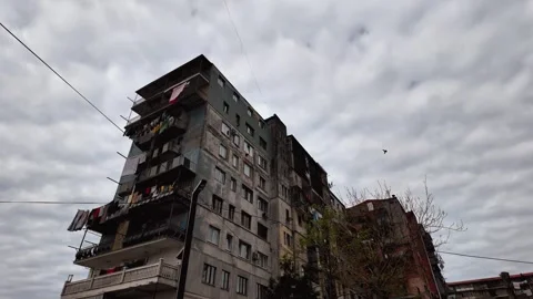Gloomy low-angle view of a post-soviet residential apartment building 库存影片 335207496