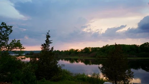 Glorious golden sunset time lapse with big fluffy clouds Stock Footage 122389945