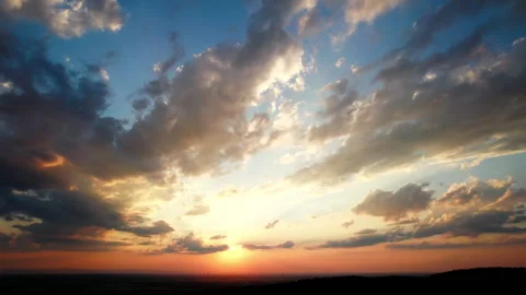 Glorious rays of sunlight through colorful clouds at sunset Stock Footage 340780884