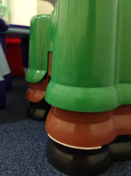 Glossy colored shiny plastic containers stacked on top of each other Stock Photos