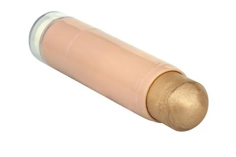 Glossy cosmetic face make-up solid foundation stick with glitter particles, t Stock Photos