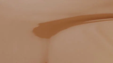 Glossy cosmetic texture, beige liquid foundation or concealer as beauty make- Stock Footage 257444366