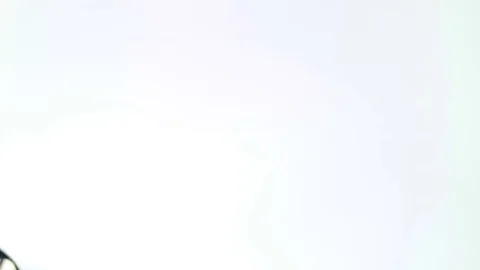 Glossy iron spoon close-up on a white background. Stock Footage 81600895