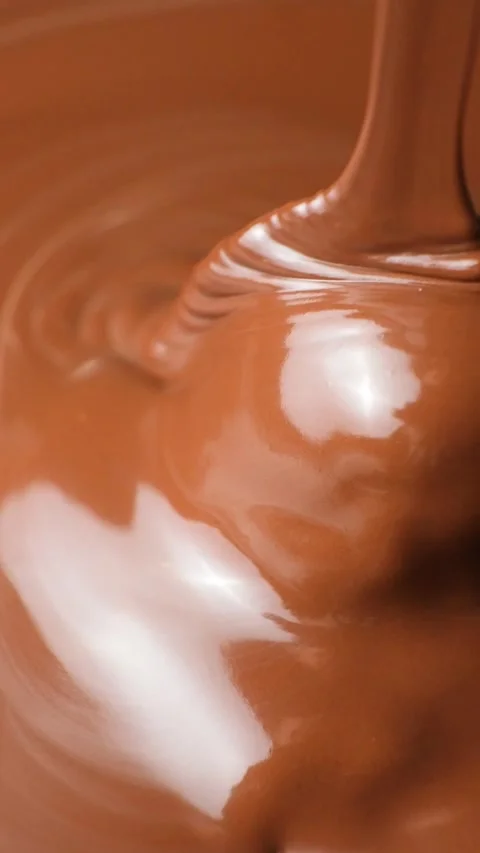 Glossy Melted Chocolate Flow in Slow Motion Close Up Stock Footage 344870622