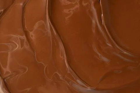 Glossy melted chocolate waves abstract background vertical macro shot Stock Photos