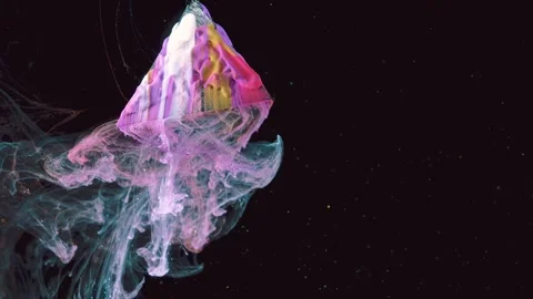 Glossy multicolored paint pyramid separating from translucent ink cloud against  Stock Footage 344329225