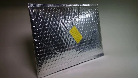 Glossy padded protective parcel envelope. Stock Footage 105539874