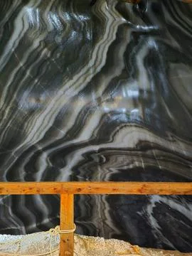 Glossy patterned salt wall inside Salina Turda salt mine Stock Photos