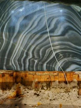 Glossy patterned salt wall inside Salina Turda Stock Photos