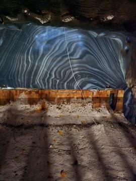 Glossy patterned salt wall inside Salina Turda Stock Photos