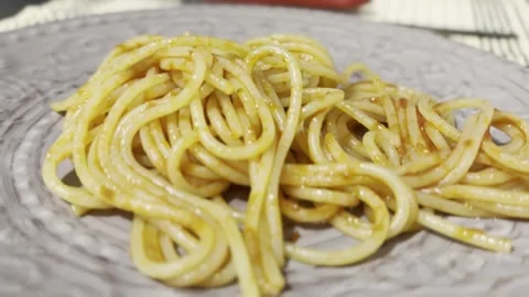 Glossy Spaghetti on Ornate Plate Stock Footage 345339191