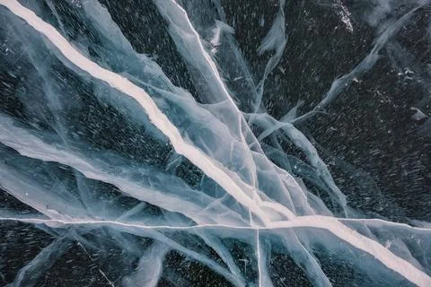Glossy surface of ice cracked surface Stock Photos