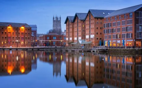 Gloucester docks and Cathedral reflected in the quay on Sharpness at twilight 写真素材
