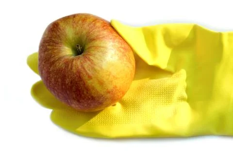 Glove with apple Stock Photos