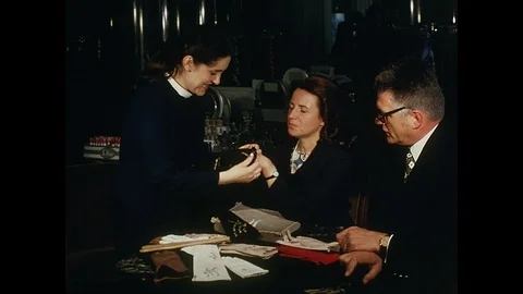 Glove shop, wide shot, fitting black gloves, Paris, 1970 Stock Footage 85874487