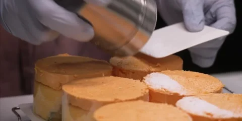Gloved Chef Dusting Powdery Sugar Over Mini Cakes Stock Footage 343589092