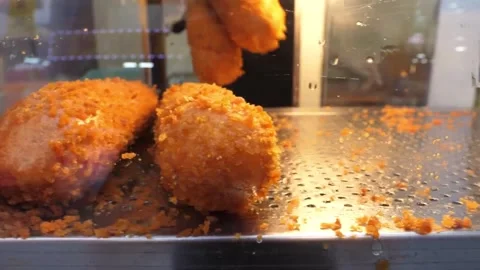 Gloved Chef Preparing Crispy Street Food Corn Dogs in Display Case Video stock 343587684