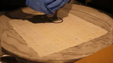 Gloved Chef Preparing Rolled Ice Cream on Cold Pan Stock Footage 345293209