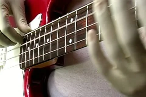 Gloved Hand Bass Player Stock Footage 14820393
