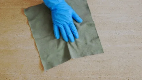 Gloved hand cleaning a marble surface Stock Footage 106659537