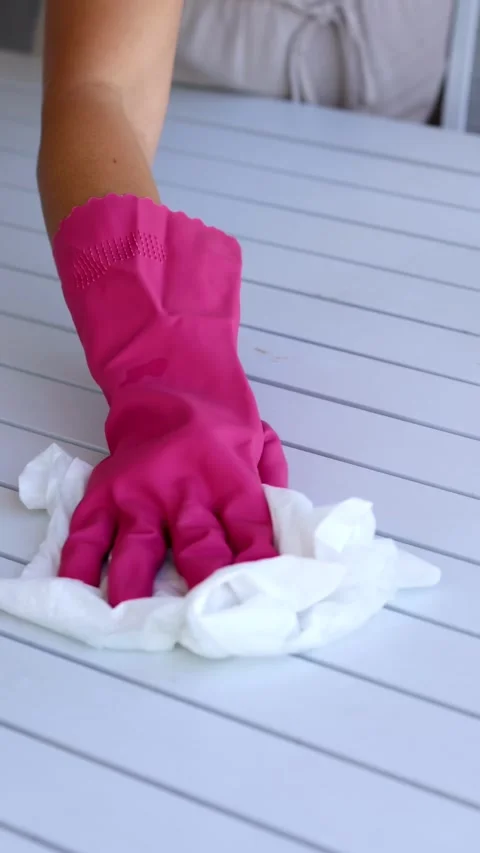 Gloved Hand Cleaning a Table with Wipe Stock Footage 312199963