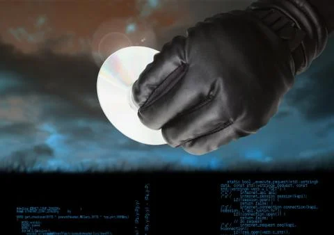 Gloved hand holding a CD in front of cloudy background Stock Photos