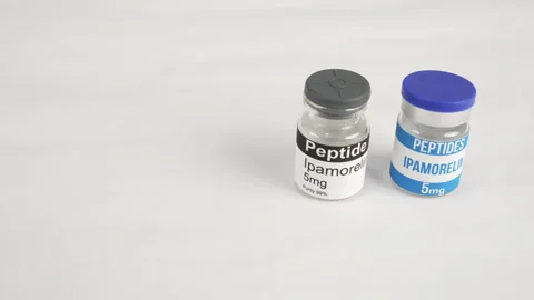 Gloved hand holding an ipamorelin peptide vial Stock Footage 345009727