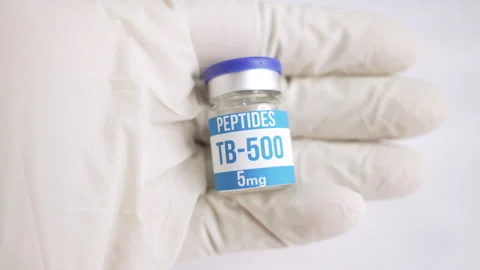 Gloved hand holding an TB 500 peptide vial Stock Footage 345009729