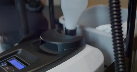 Gloved Hand Inserting White Tank Into Steam Cleaner With Blue Display Stock Footage 340274821