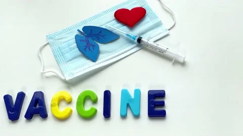 Gloved hand putting paper lungs, heart and pills Stock Footage 164156494