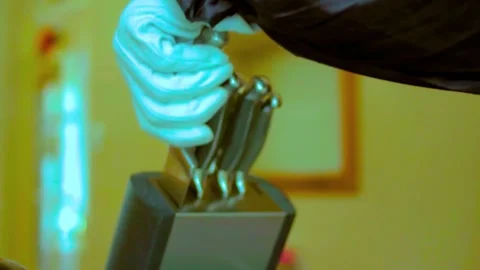 Gloved hand retrieves sharp knife from block, slow motion clip Stock Footage 345523152