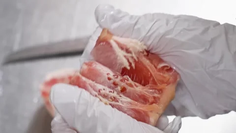 Gloved Hand Slicing Fresh Red Grapefruit Fruit for Dessert Preparation Stock Footage 343019877