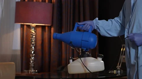 Gloved hand with sprayer during room disinfection Stock-Footage 148110683