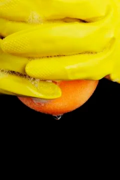 Gloved hand squeezes Stock Photos